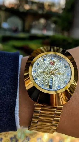 Luxurious Rado Diastar Men's Gold Watch with Diamond-Studded Dial and Day-Date Display