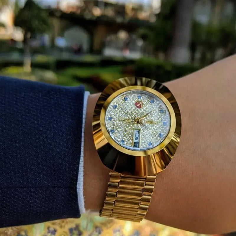 Luxurious Rado Diastar Men's Gold Watch with Diamond-Studded Dial and Day-Date Display